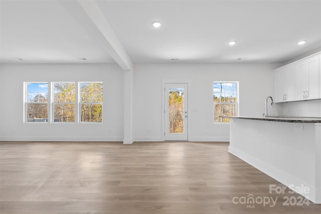 183 Sugar Hill Rd, Troutman, NC 28166 - unfurnished living room with recessed lighting, baseboards, and light wood-style floors