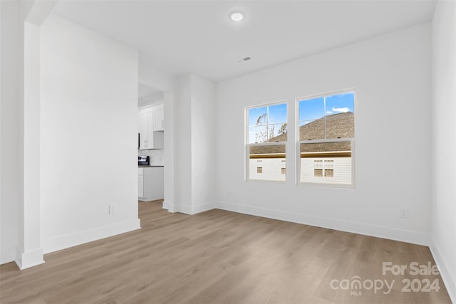 183 Sugar Hill Rd, Troutman, NC 28166 - spare room featuring light wood-style flooring, baseboards, and recessed lighting