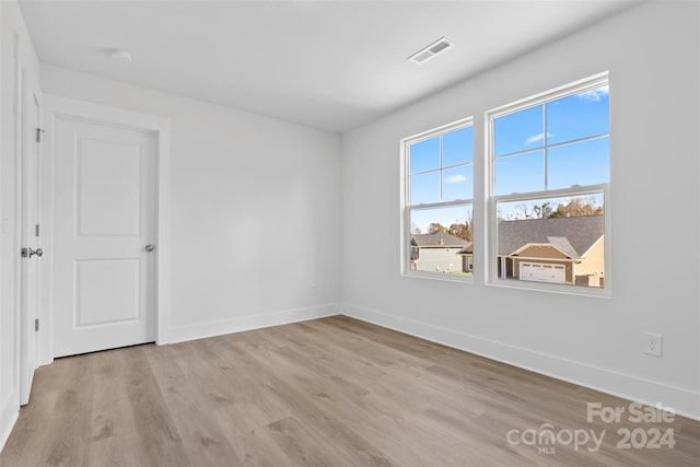 183 Sugar Hill Rd, Troutman, NC 28166 - spare room featuring light wood finished floors, baseboards, and a smoke detector