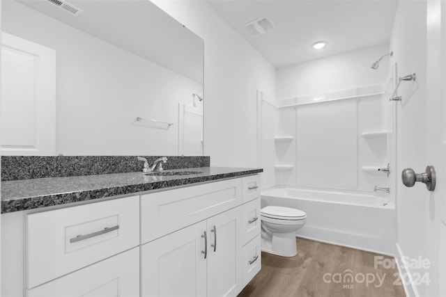 183 Sugar Hill Rd, Troutman, NC 28166 - full bath with toilet, vanity, wood finished floors, and bathtub / shower combination