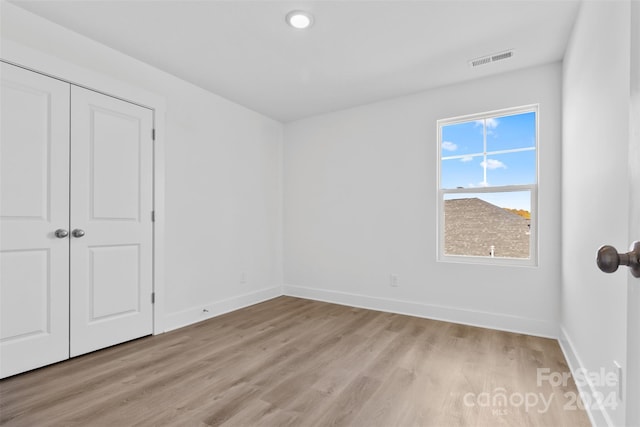183 Sugar Hill Rd, Troutman, NC 28166 - unfurnished bedroom featuring light wood-type flooring, baseboards, and a closet