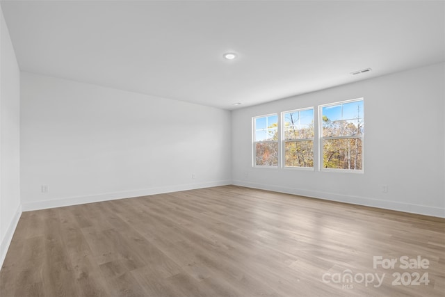 183 Sugar Hill Rd, Troutman, NC 28166 - empty room featuring light wood finished floors, baseboards, and recessed lighting
