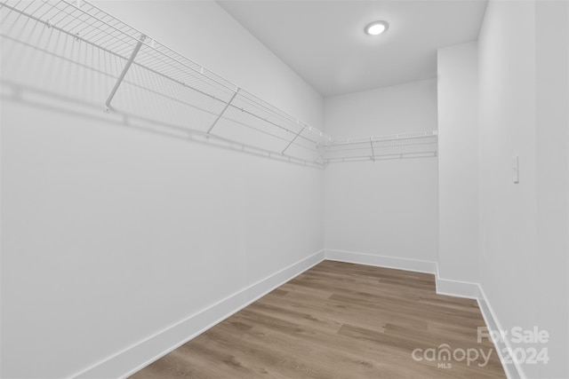 183 Sugar Hill Rd, Troutman, NC 28166 - spacious closet featuring wood finished floors