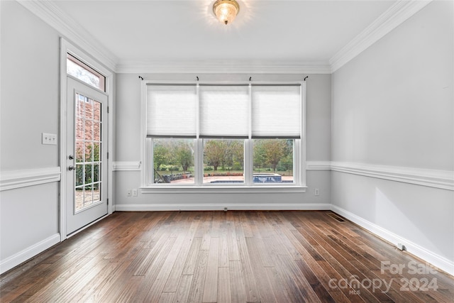 unfurnished room with dark hardwood / wood-style floors and crown molding