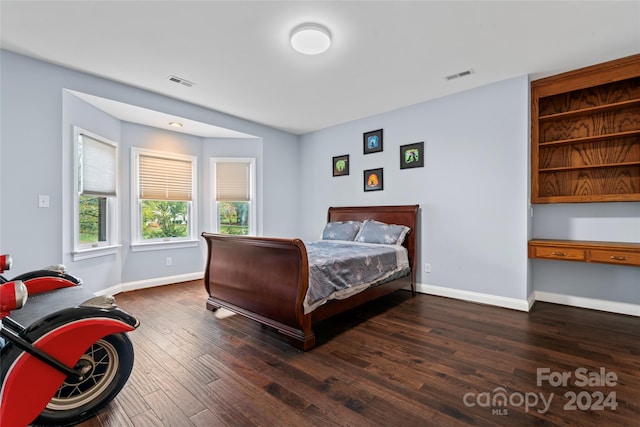 bedroom featuring dark hardwood / wood-style floors