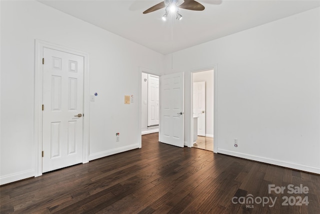 unfurnished bedroom featuring ceiling fan and dark hardwood / wood-style floors