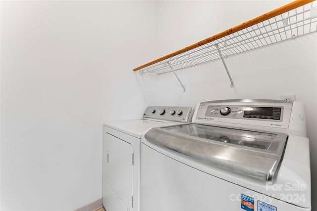 laundry room with independent washer and dryer