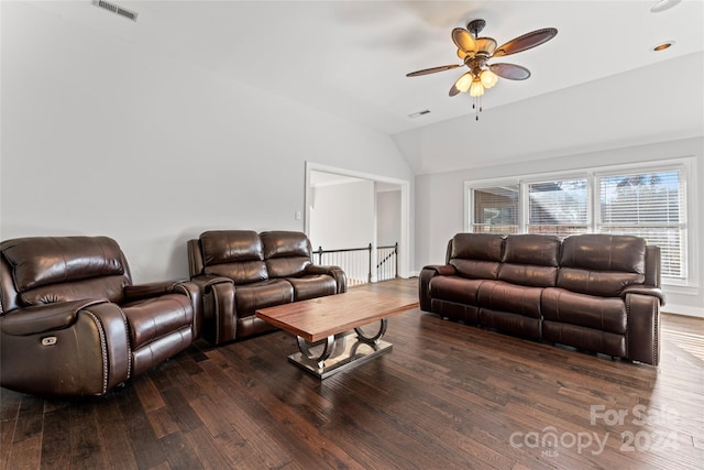 living room featuring lofted ceiling, dark hardwood / wood-style floors, and ceiling fan