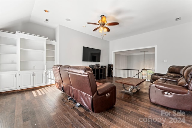 living room with dark wood-type flooring, ceiling fan, and lofted ceiling