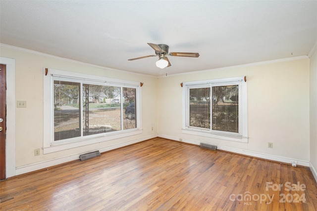 unfurnished room with hardwood / wood-style flooring, ceiling fan, crown molding, and a textured ceiling