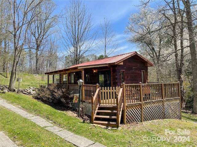 view of front of property with a wooden deck