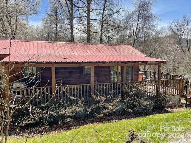 view of front of house with a wooden deck