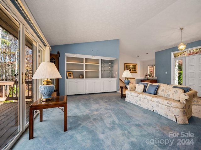 living room featuring lofted ceiling and carpet floors