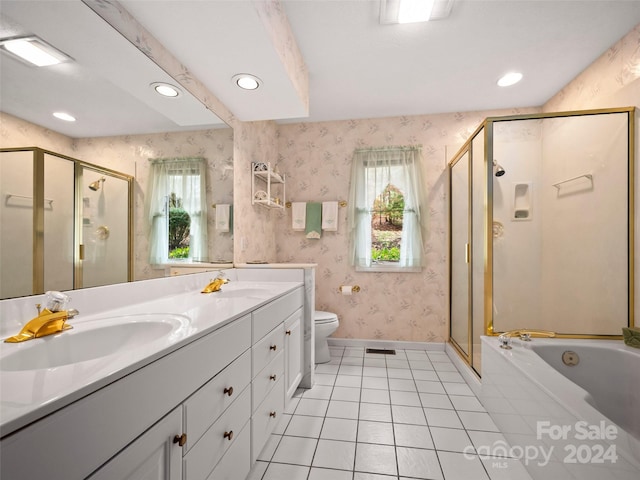 full bathroom with toilet, independent shower and bath, vanity, and tile patterned floors