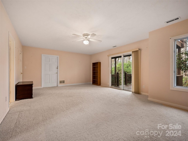 carpeted empty room with ceiling fan