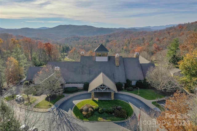 birds eye view of property with a mountain view