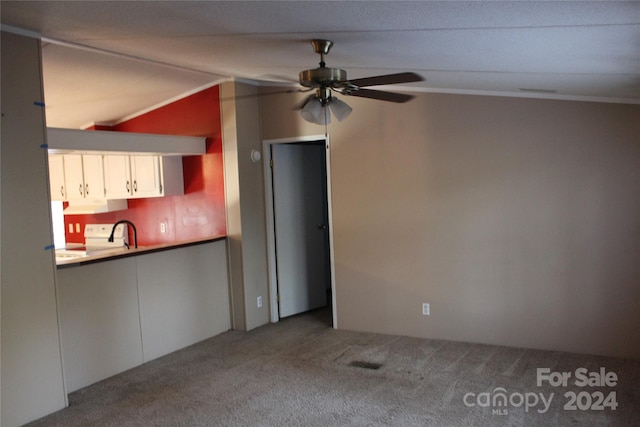 kitchen with white cabinets, carpet, ceiling fan, and white stove