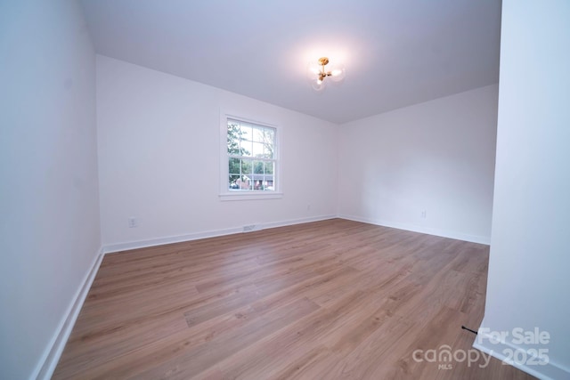 unfurnished room featuring light wood-type flooring