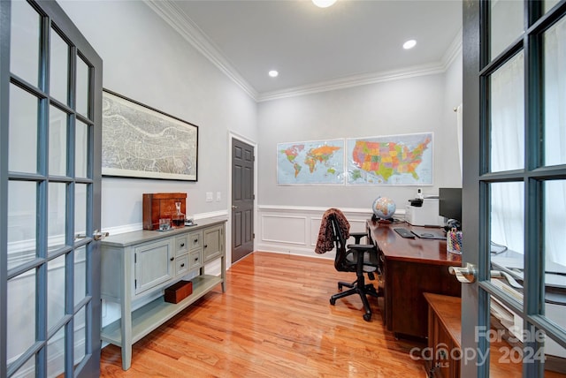 home office featuring french doors, light hardwood / wood-style flooring, and ornamental molding