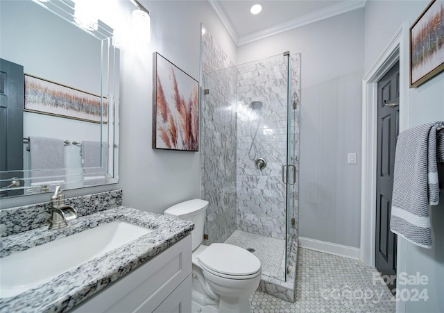 bathroom featuring vanity, a shower with door, crown molding, tile patterned flooring, and toilet