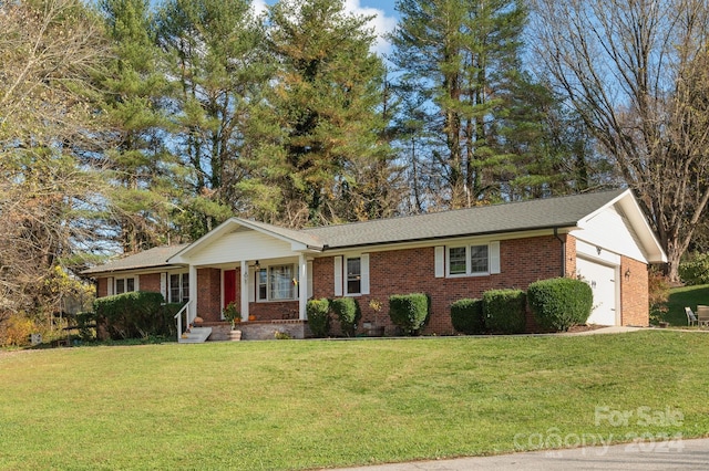 ranch-style home with a garage and a front lawn