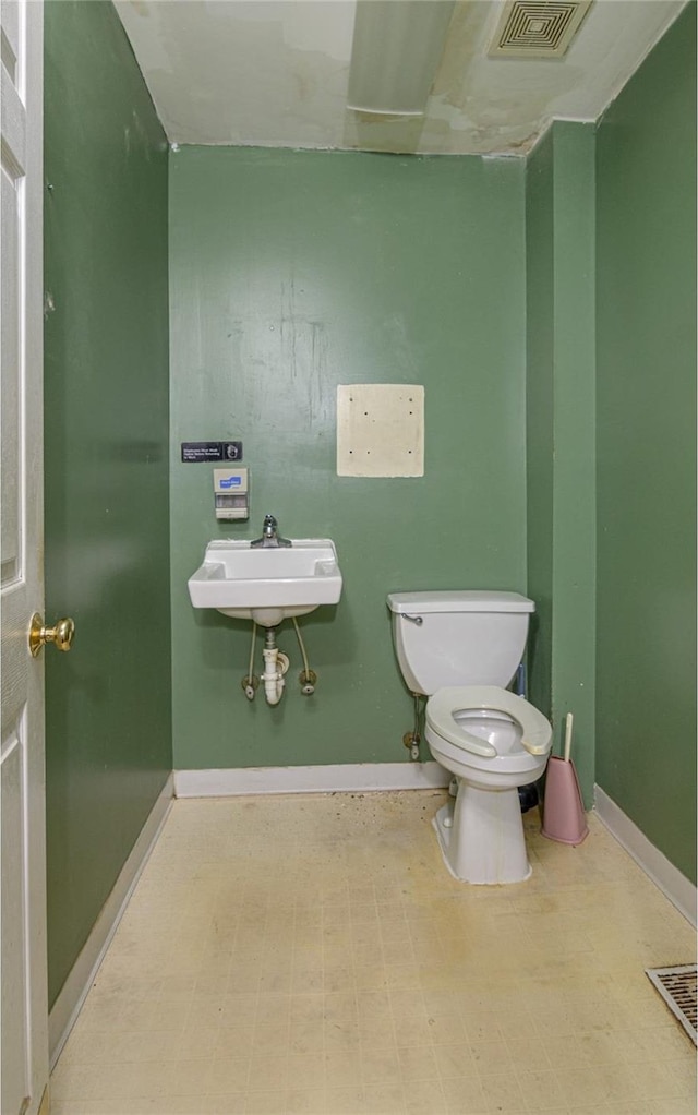 bathroom with toilet and sink