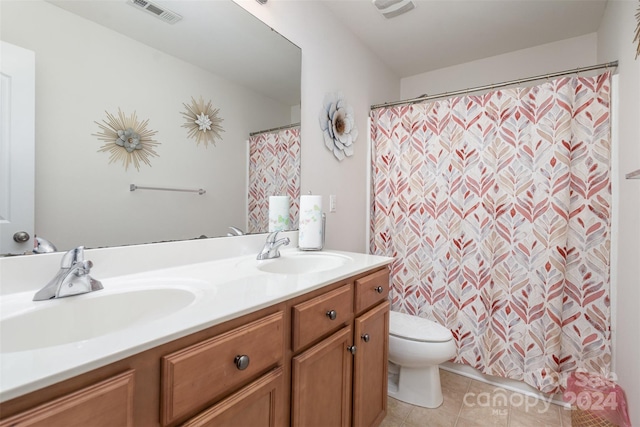 bathroom featuring tile patterned flooring, vanity, toilet, and a shower with shower curtain