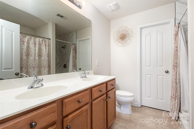 bathroom featuring tile patterned flooring, vanity, toilet, and a shower with shower curtain