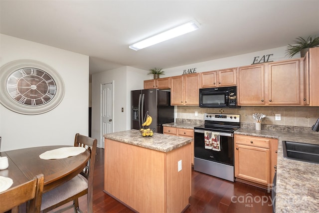 kitchen featuring decorative backsplash, a center island, dark wood-type flooring, and black appliances