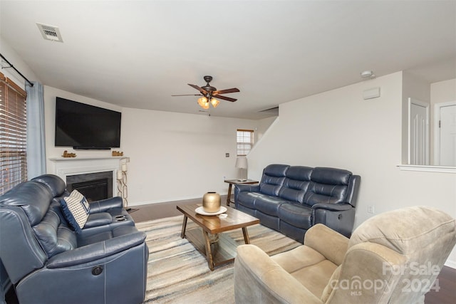 living room featuring ceiling fan and wood-type flooring