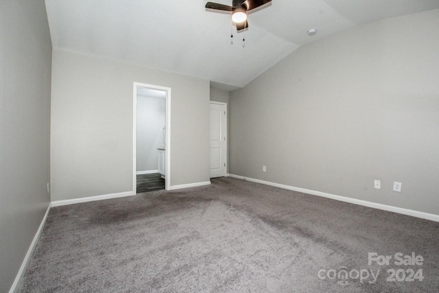 unfurnished bedroom with carpet flooring, ceiling fan, and lofted ceiling