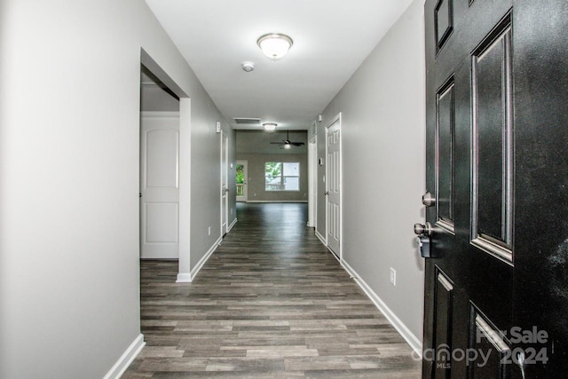 corridor featuring wood-type flooring