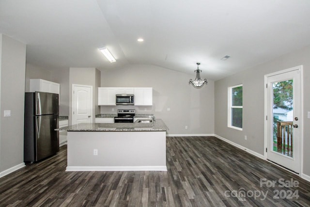 kitchen featuring white cabinets, stainless steel appliances, a kitchen island with sink, and vaulted ceiling