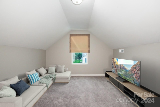 living room featuring light colored carpet and lofted ceiling