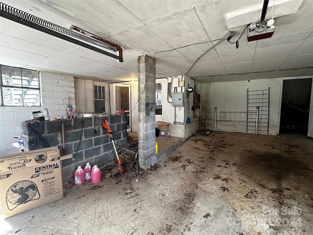 garage featuring a garage door opener and electric panel