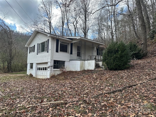 view of side of property featuring a porch