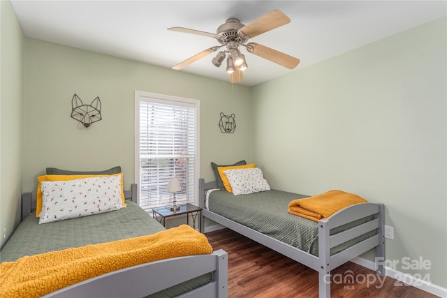 bedroom featuring dark wood-type flooring and ceiling fan