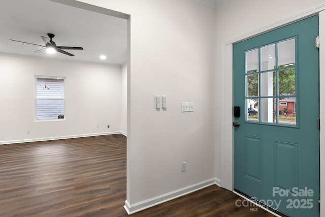 foyer featuring ceiling fan, dark hardwood / wood-style flooring, and ornamental molding