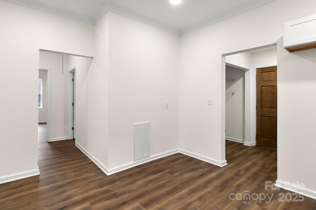 hallway with dark hardwood / wood-style floors and ornamental molding