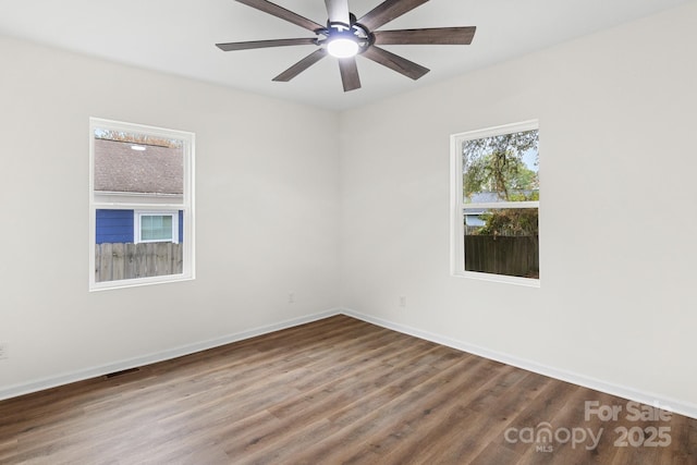 spare room featuring ceiling fan and wood-type flooring