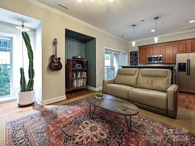 living room with french doors, dark hardwood / wood-style floors, and crown molding