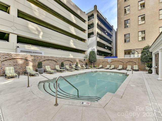 view of swimming pool featuring a patio