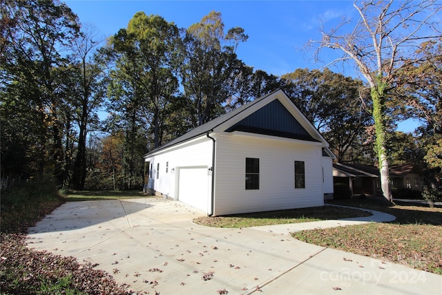 view of property exterior with a garage