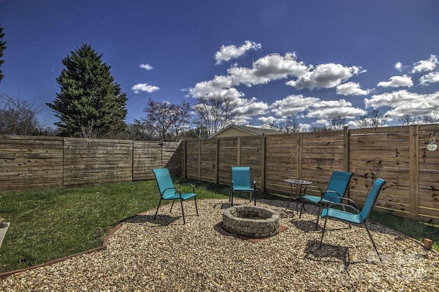 view of patio / terrace featuring an outdoor fire pit