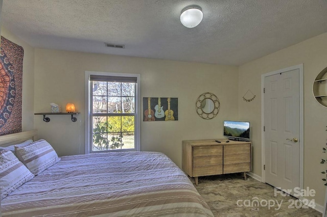 bedroom with a textured ceiling