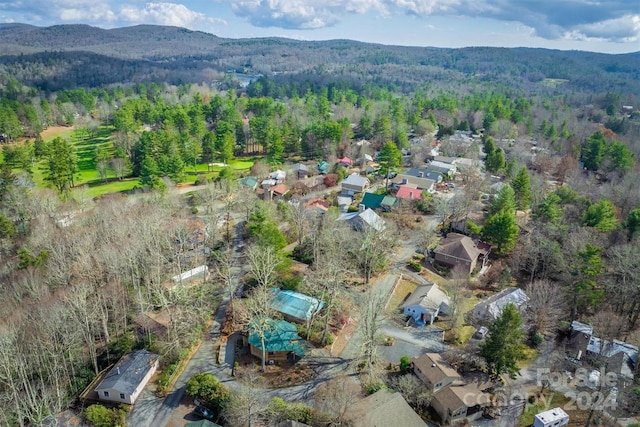 33 Summit Ln, Newland, NC 28657 - aerial view of property's location featuring a forest, a mountainous background, and nearby suburban area