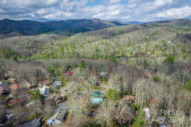 33 Summit Ln, Newland, NC 28657 - aerial view of property and surrounding area featuring a mountain backdrop and a heavily wooded area