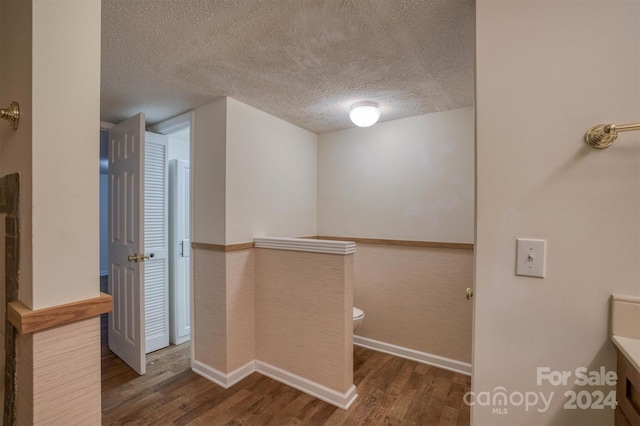 33 Summit Ln, Newland, NC 28657 - corridor featuring wood finished floors, a textured ceiling, and baseboards