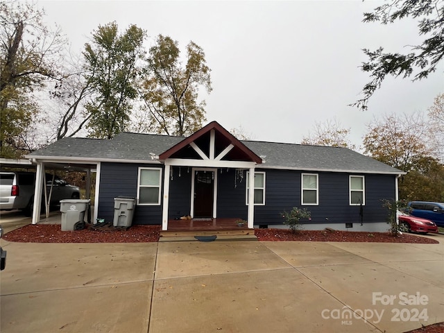 view of front of house with a carport