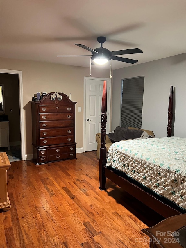 bedroom featuring hardwood / wood-style floors and ceiling fan